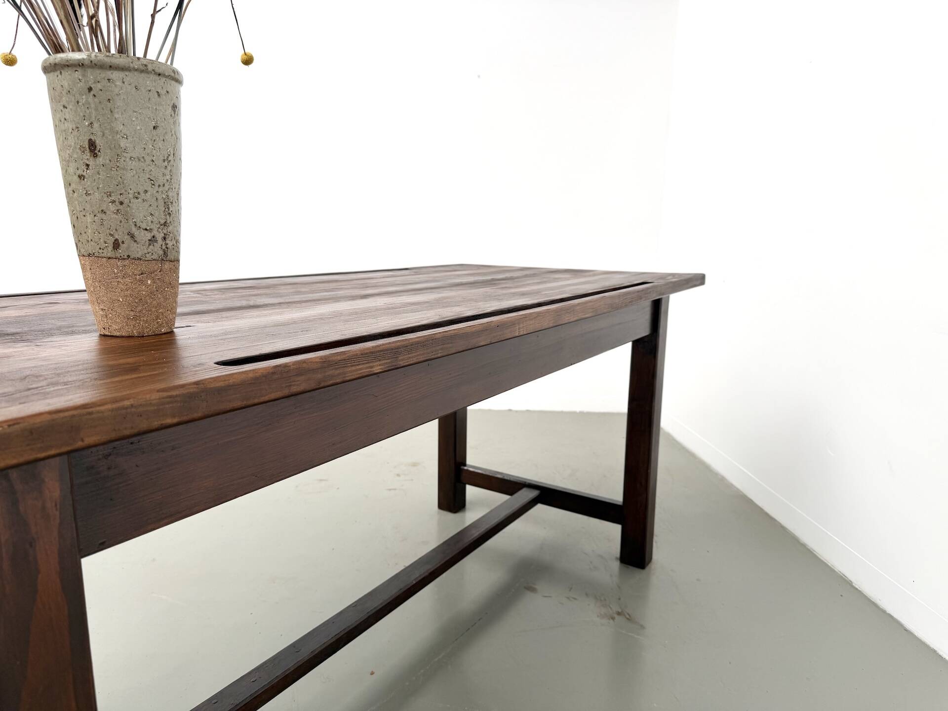 Solid pine workbench, grooved top, satin brown finish.