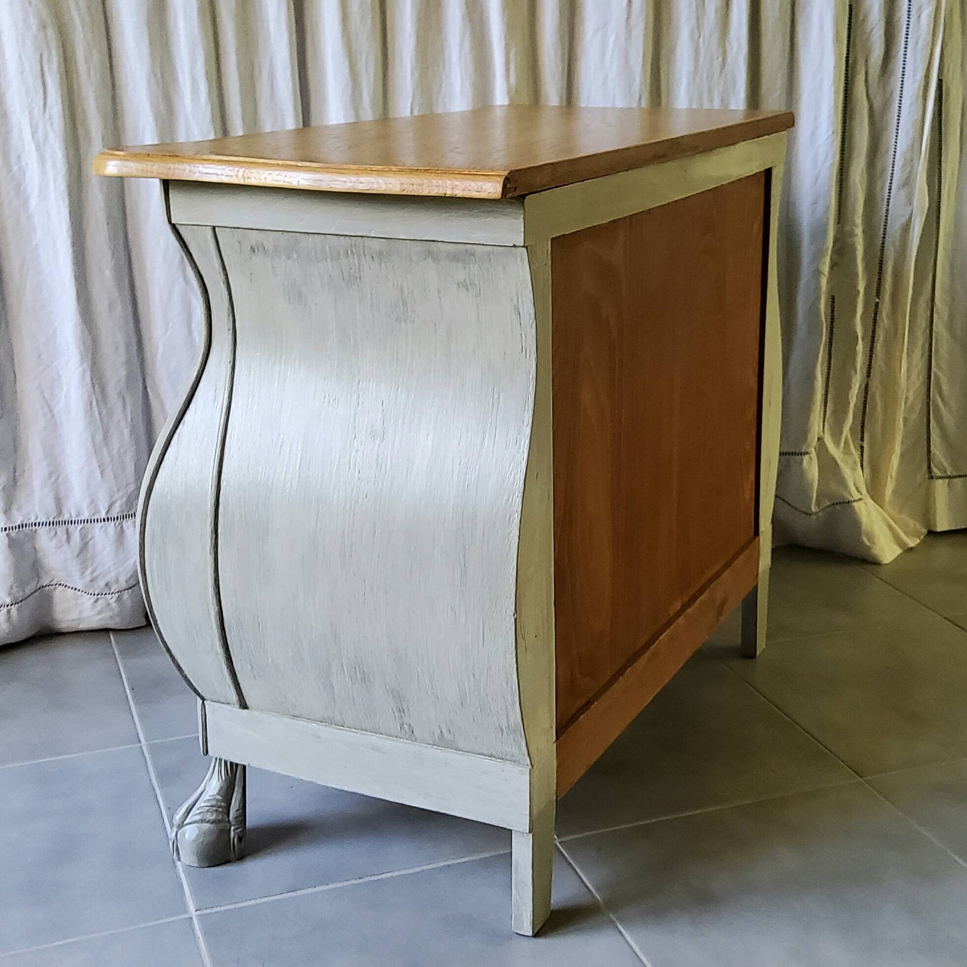 Curved patinated chest of drawers