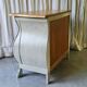 Curved patinated chest of drawers