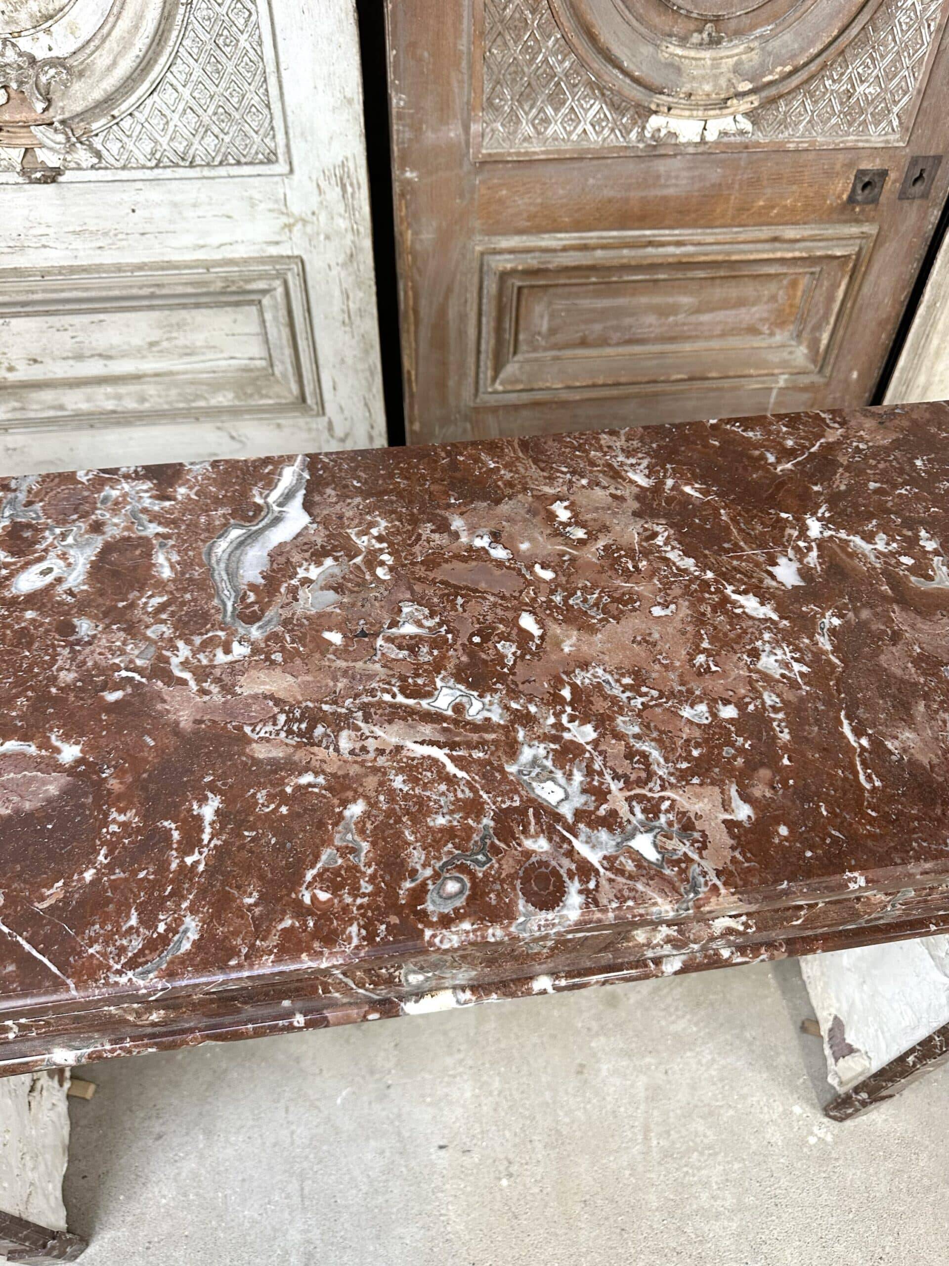 Red marble fireplace in the Louis XVI style, late 19th century