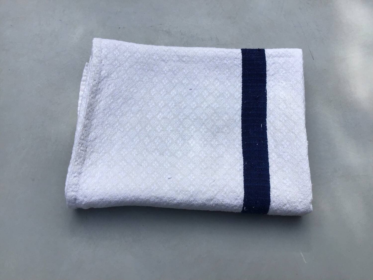 Old ecru Basque linen tea towel with navy blue stripes