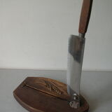 Old wooden bread cutter carved sheaf of wheat and metal deco kitchen Normandy countryside