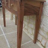 Console in solid walnut with a natural finish, featuring three drawers with a belt.
