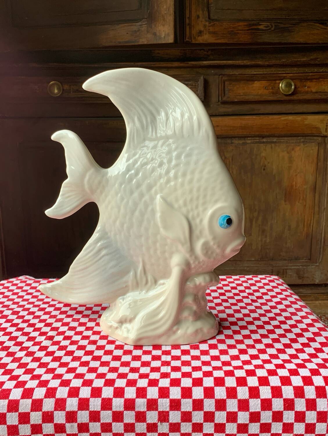 Large white ceramic fish to place.