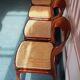 Suite de 6 chaises traineau Baumann cannées vintage