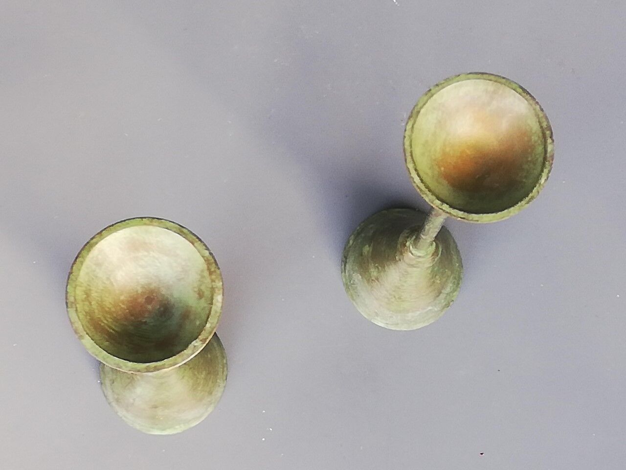 Pair of bronze patina metal candlesticks