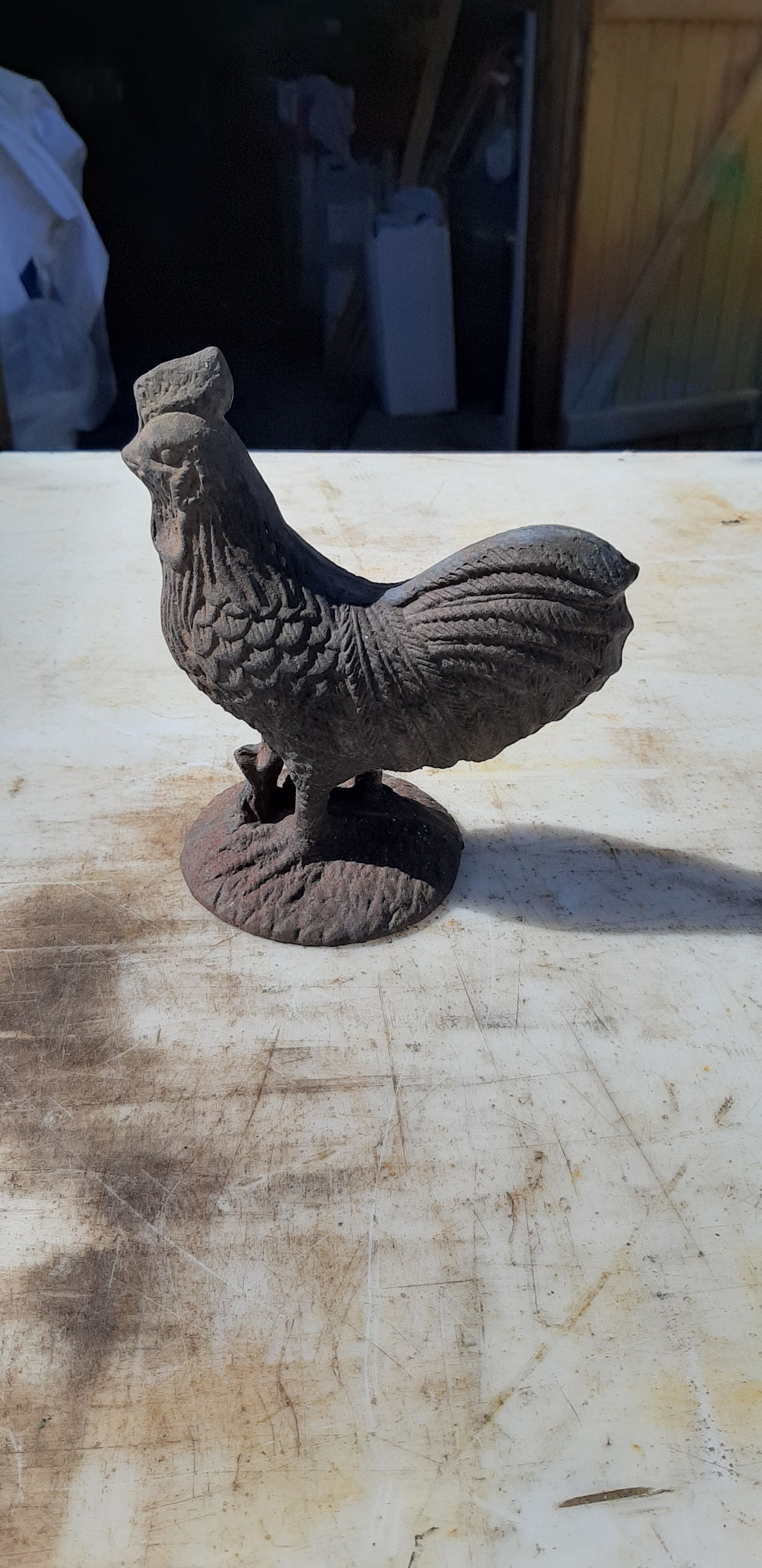 2 roosters and 2 cast iron birds