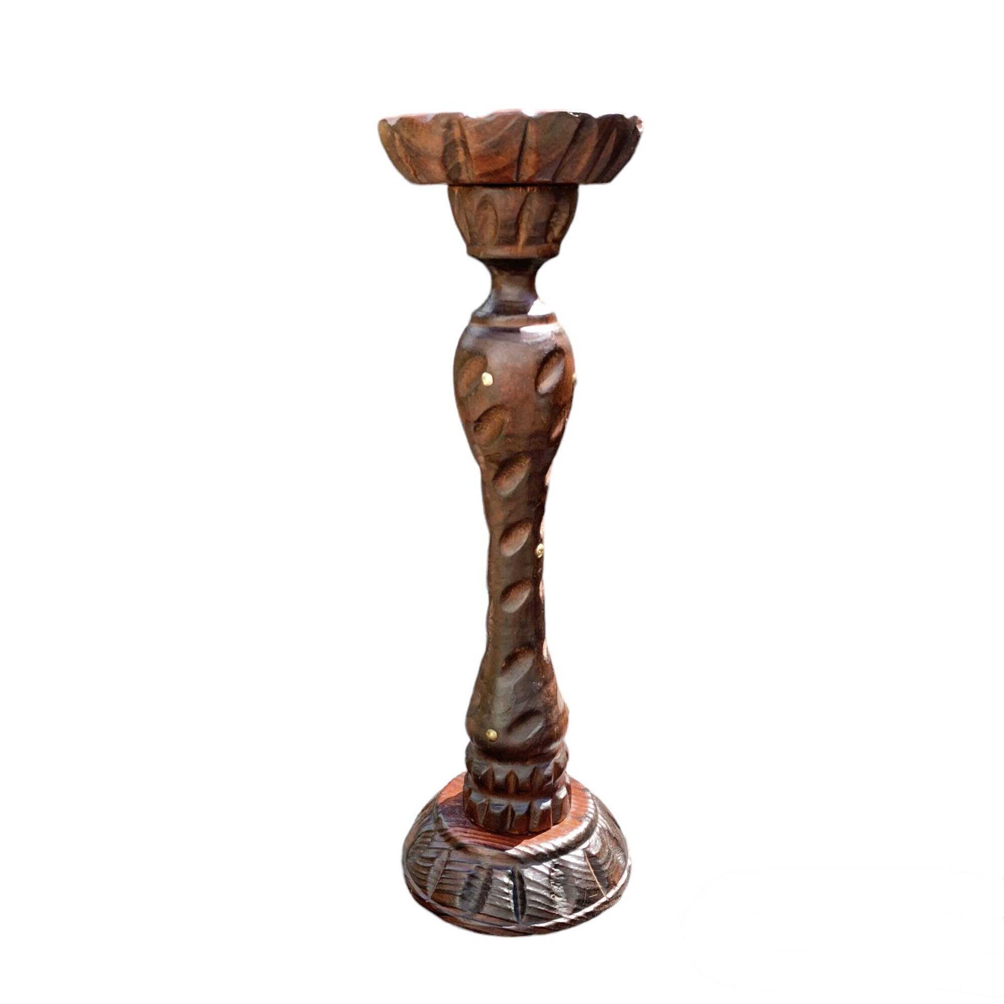 Old ashtray on carved wooden stand