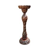 Old ashtray on carved wooden stand