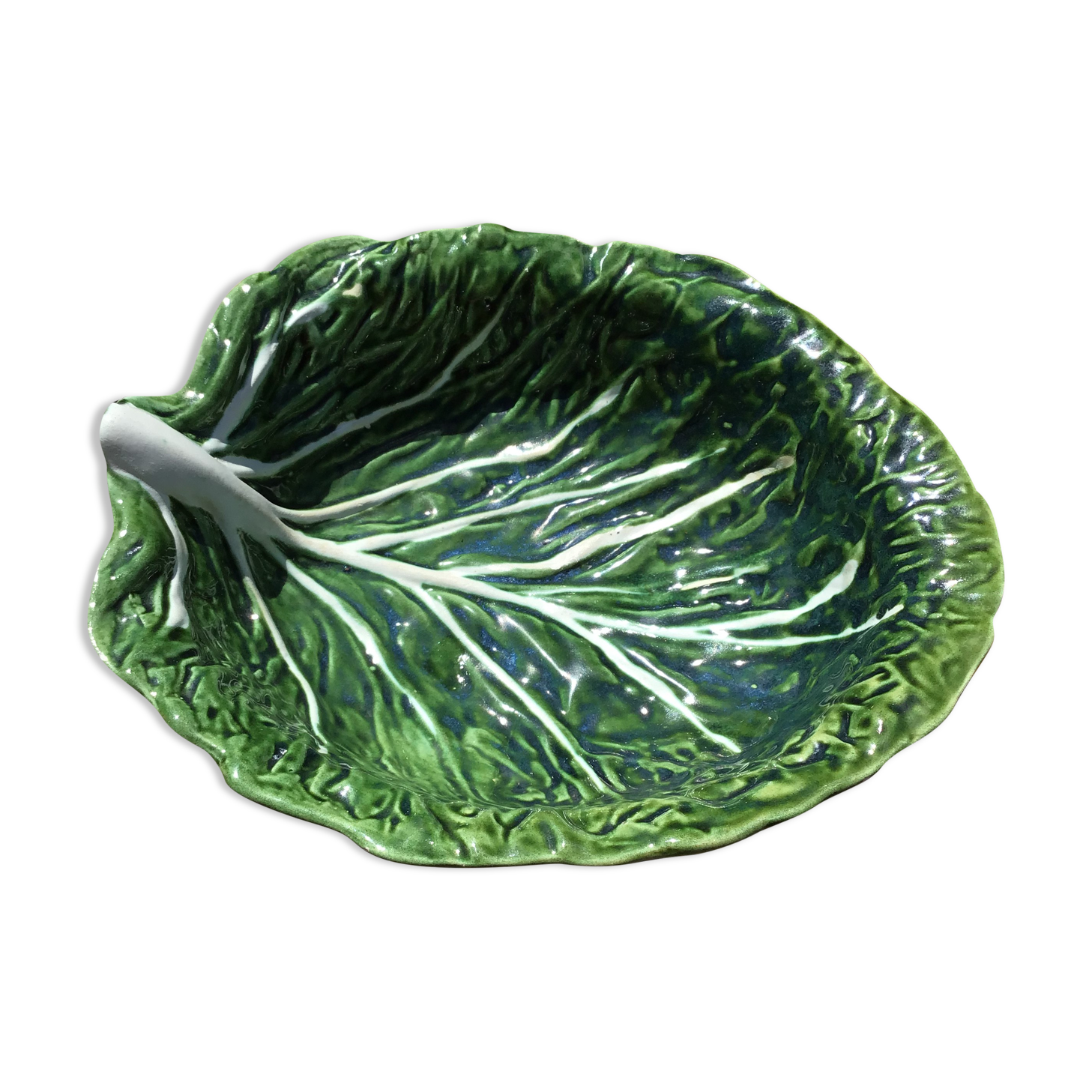 Salad bowl or vegetable cabbage leaf in green slurry