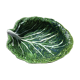 Salad bowl or vegetable cabbage leaf in green slurry