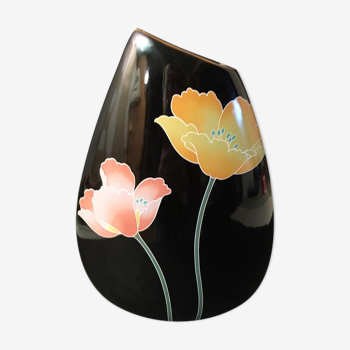 Faience vase with stylized flowers on a black background