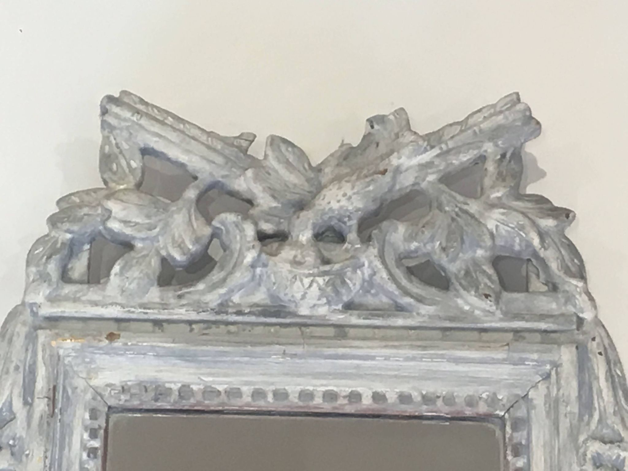 Louis XVI Style Mirror in Carved Wood with Grey Patina and Dove Pediment