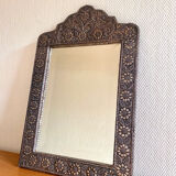 Ancient oriental mirror in embossed copper