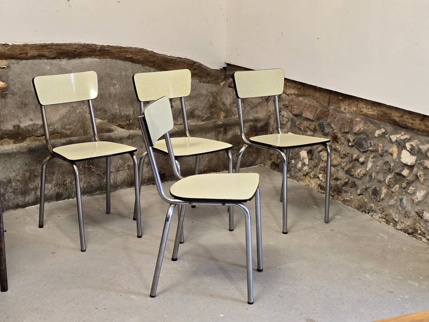 Set of 4 light yellow formica chairs