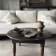 Coffee table, round antique Indonesian teak table with straight legs.