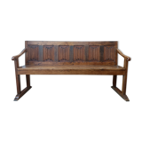 Oak church bench period XVII th century, back decorated with carved parchments