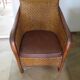Woven rattan armchair and exotic wood in colonial style, 1980s.
