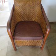 Woven rattan armchair and exotic wood in colonial style, 1980s.