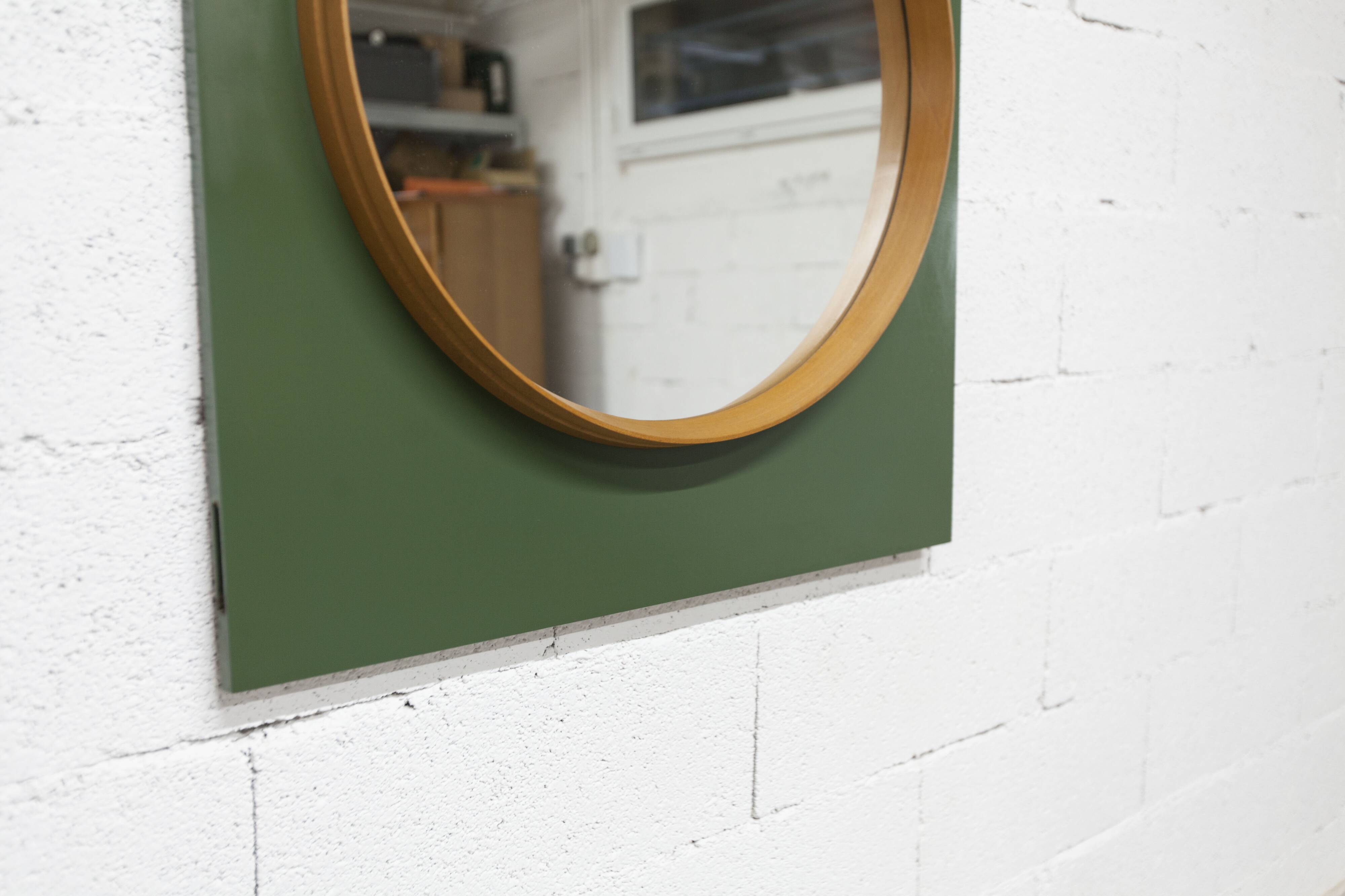 Unusual round wall mirror 60 cm teak edge on green rectangular board 1960.