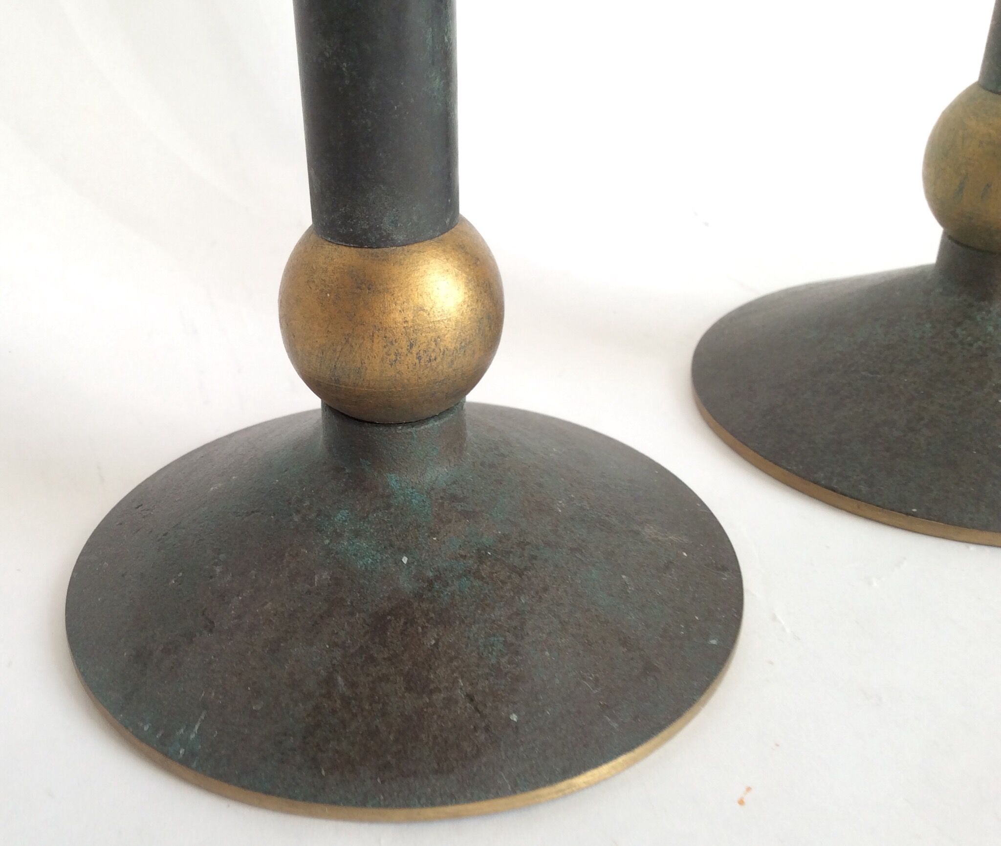Pair of patinated bronze candlesticks