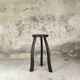 Vintage tripod plant stand with curved legs.