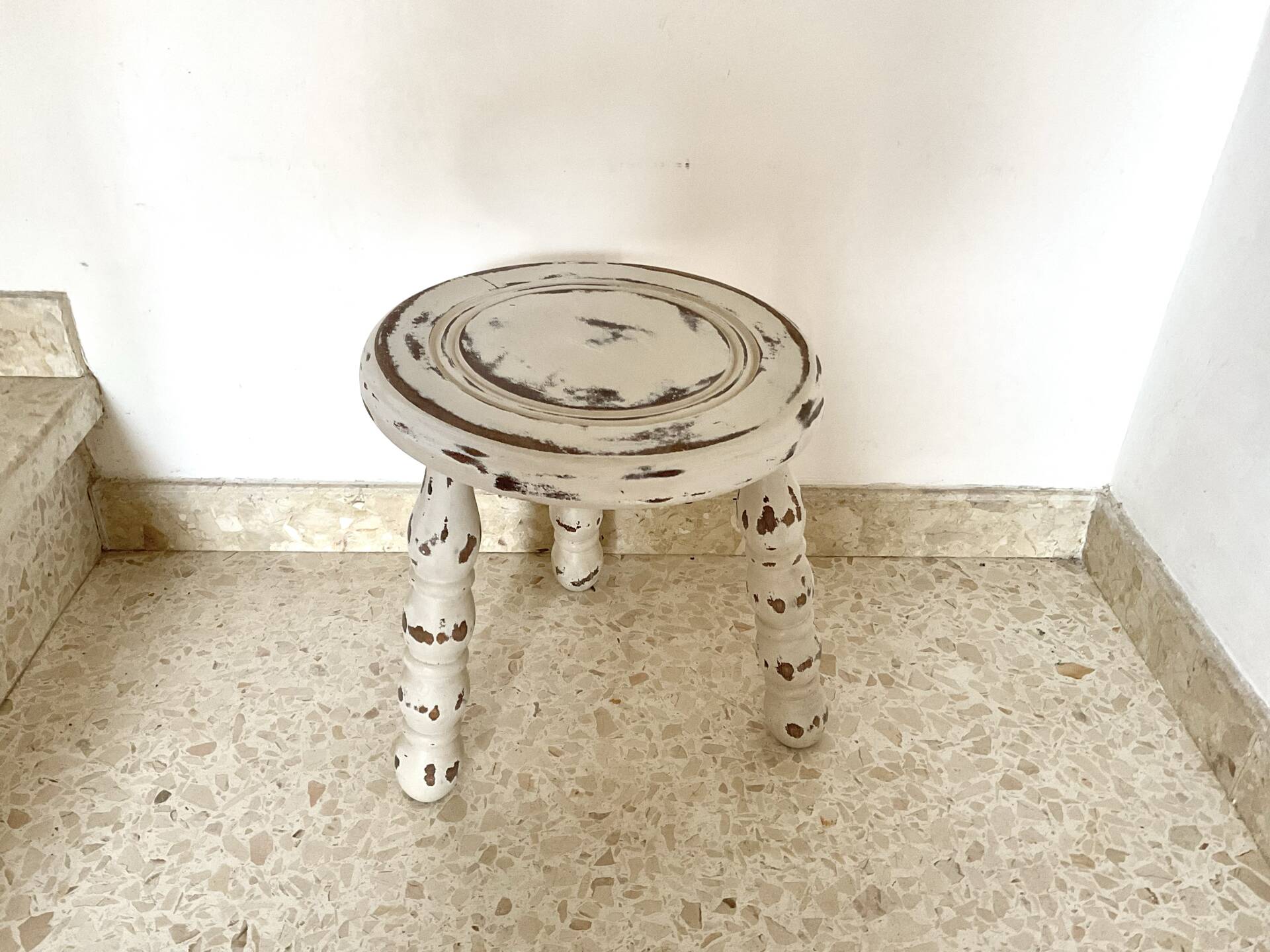 Patinated tripod stool