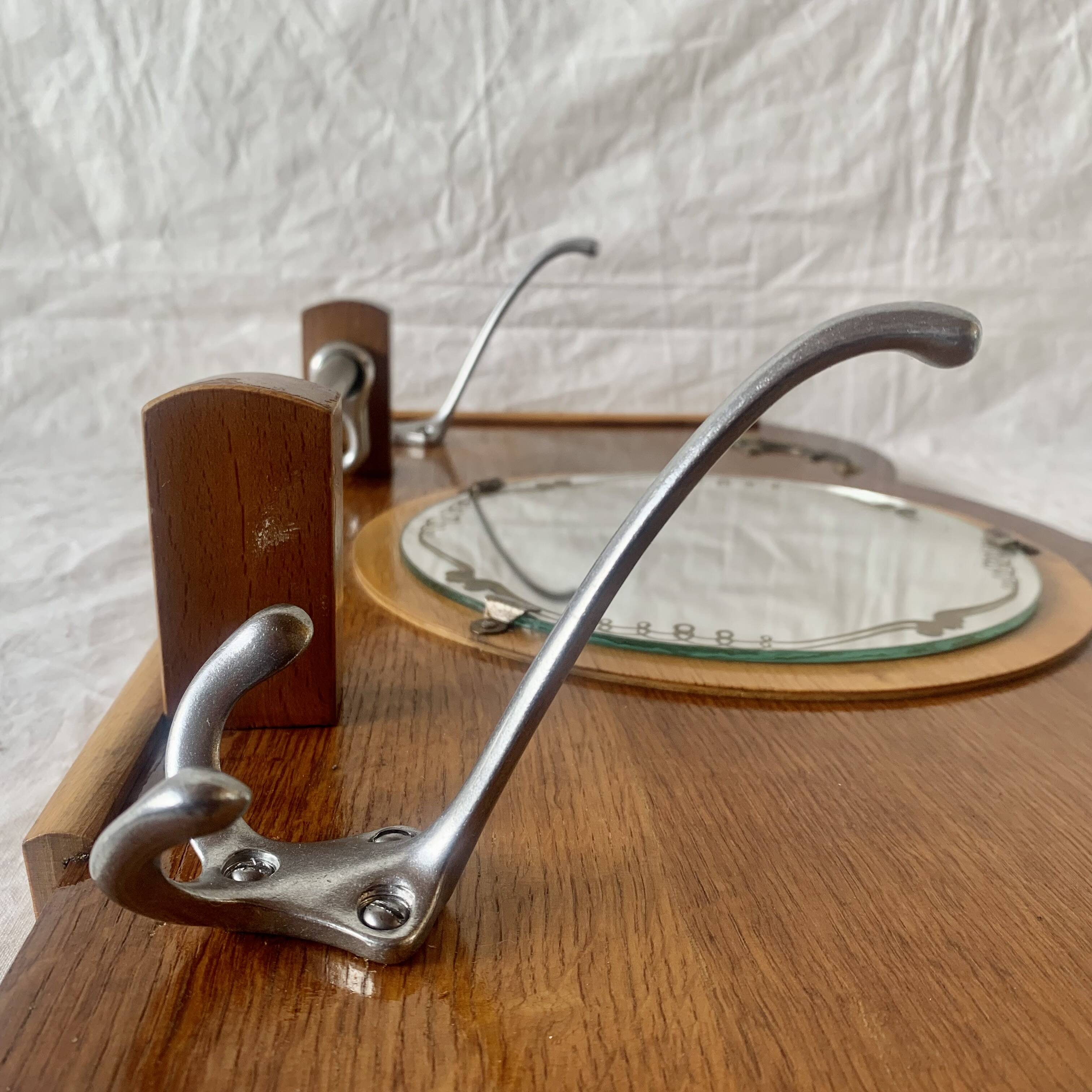 Art Deco wooden wall coat rack with round central mirror