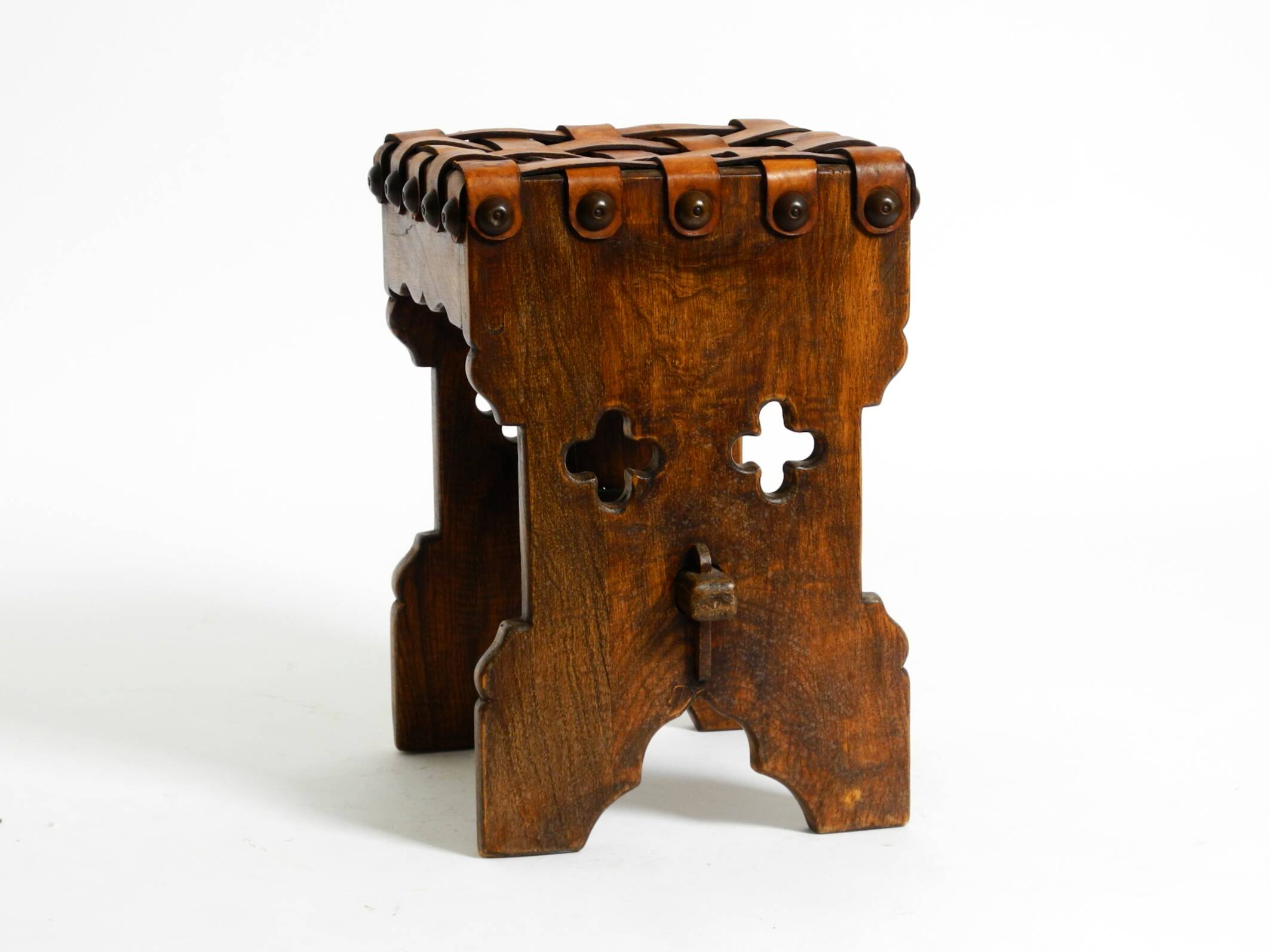 Beautiful 1940s oak stool with a seat made of leather straps
