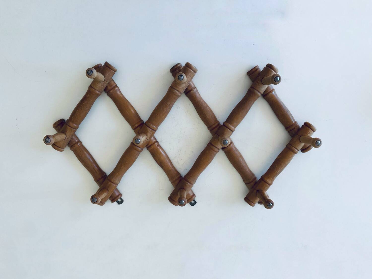 Old wooden wall coat rack