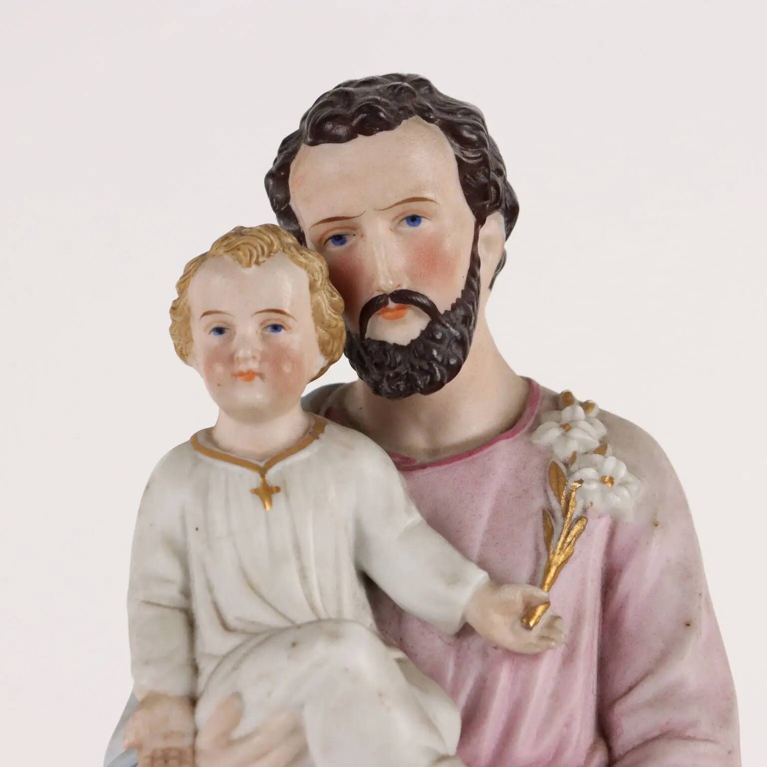 Ancient sculpture of Saint Joseph in a display case, Italy 1900s, polychrome porcelain.