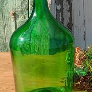 Superb antique green glass demijohn.