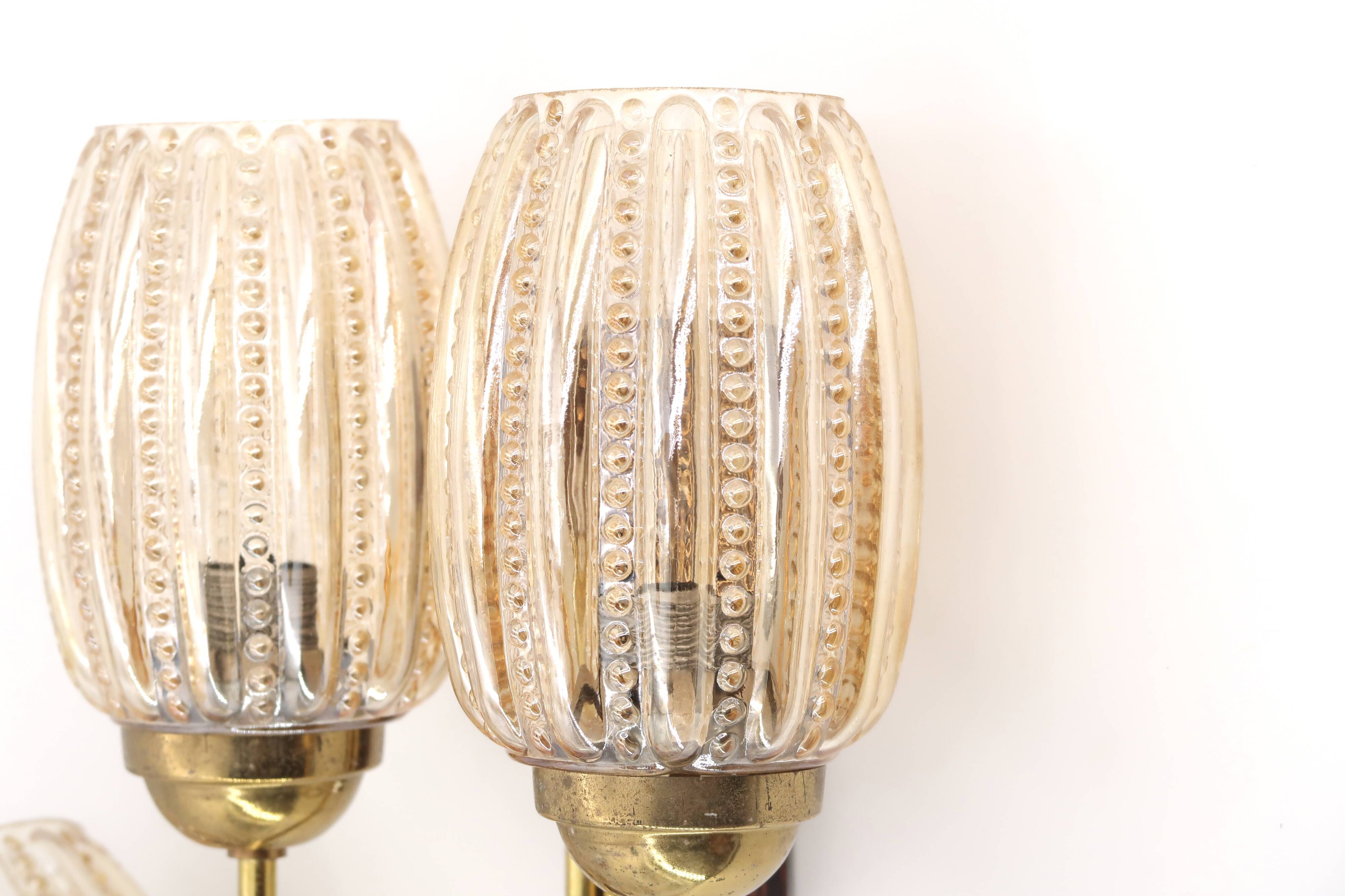 Pair of Graewe wall lights in brass and tinted glass, 1960s