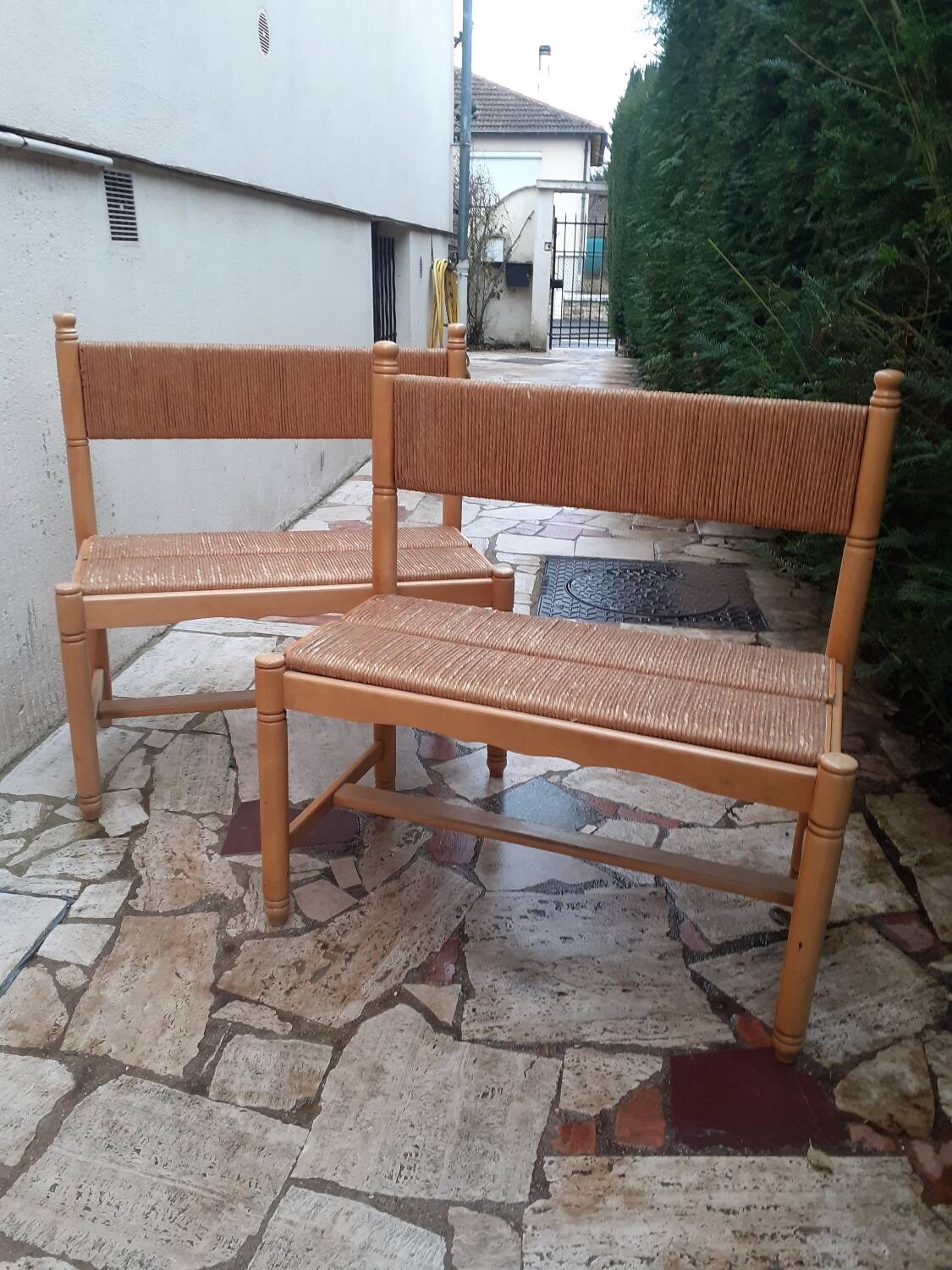 2 wooden and straw benches