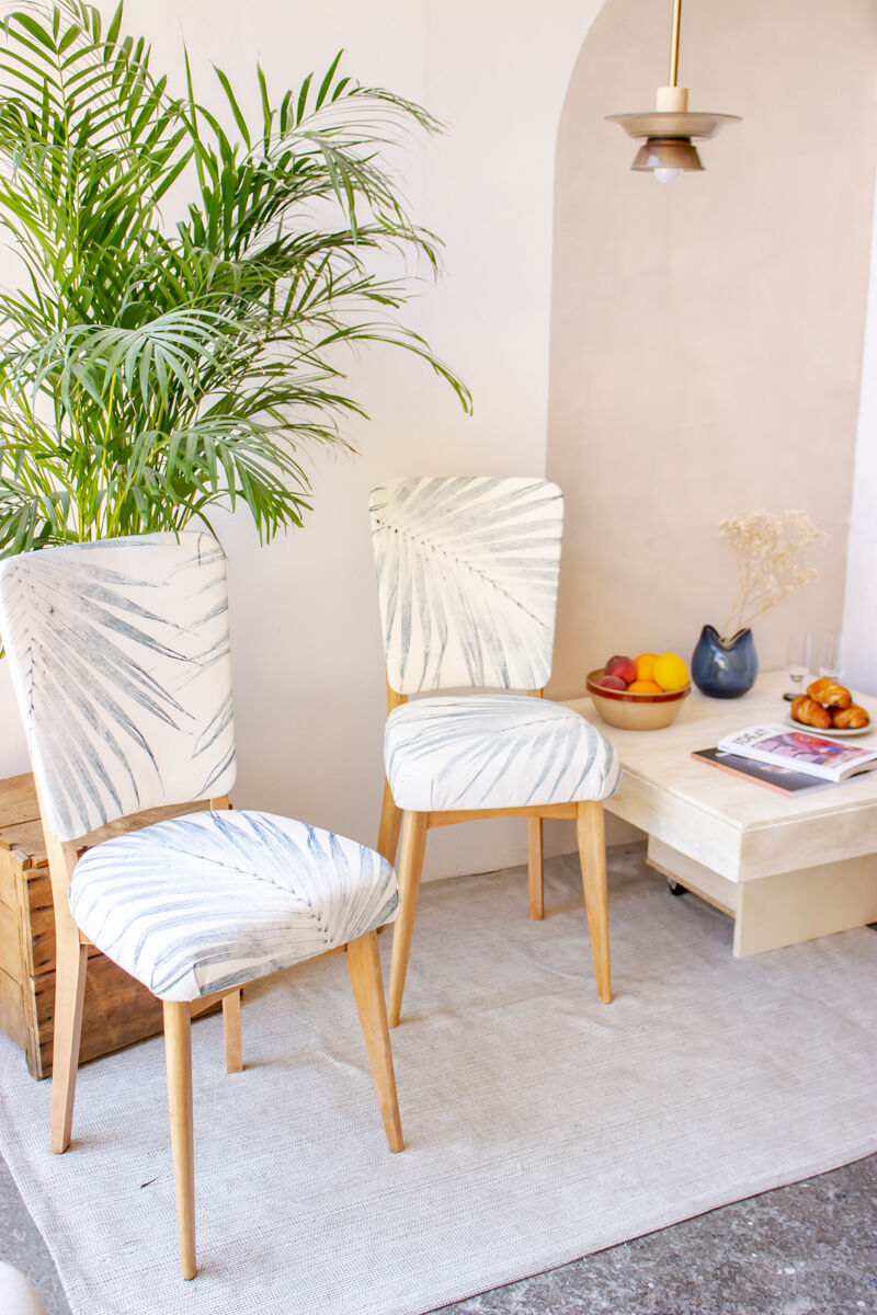 Pair of vintage chairs reupholstered with palm pattern fabric