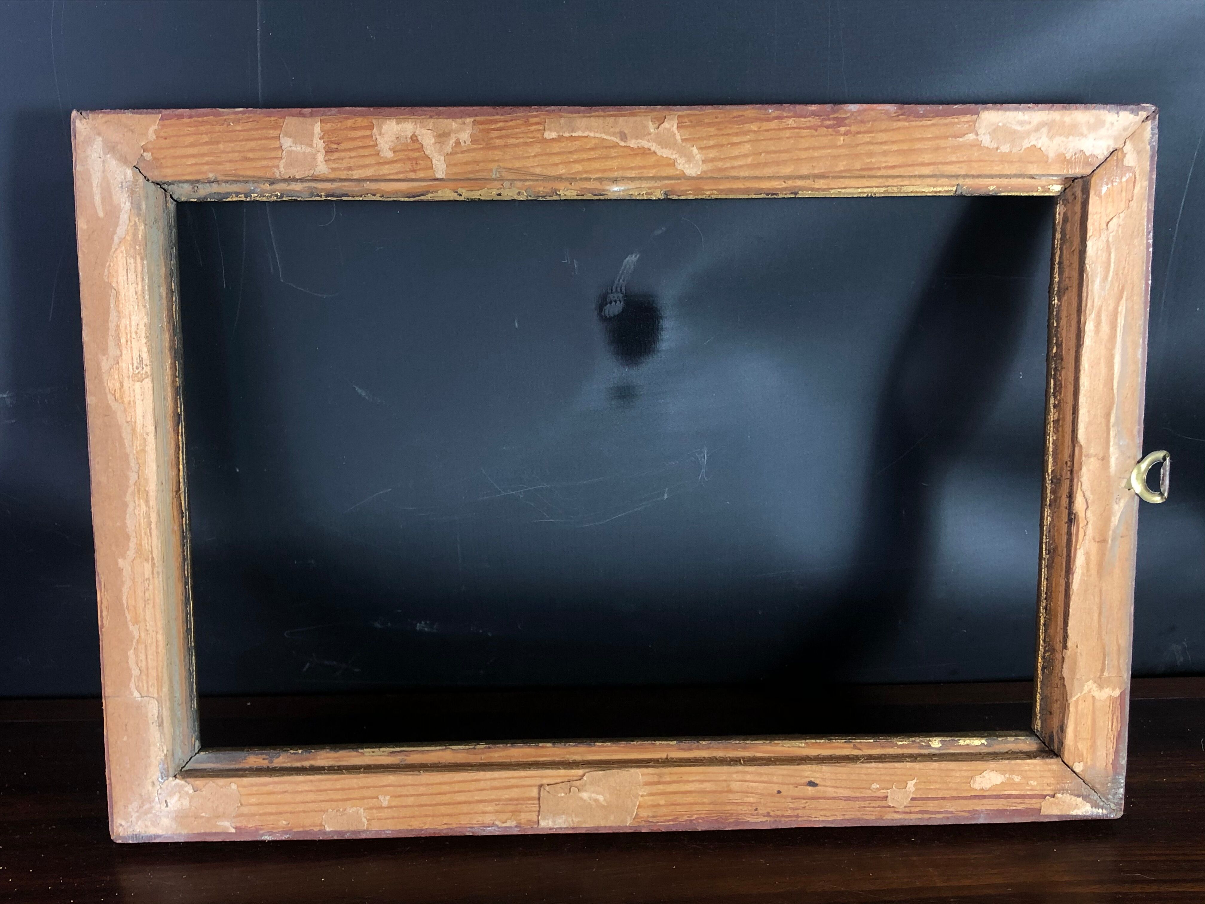 Old frame wood and stucco patinated and gilded