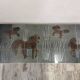 Table basse années 70 à décor de chevaux