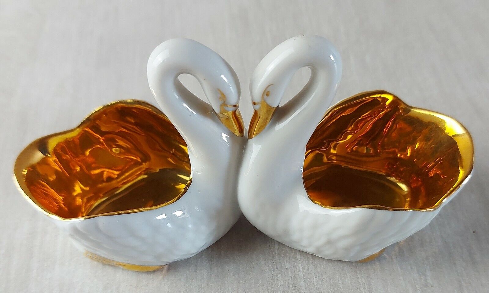 Old porcelain saleron, swan shape, gilded decoration, France porcelain