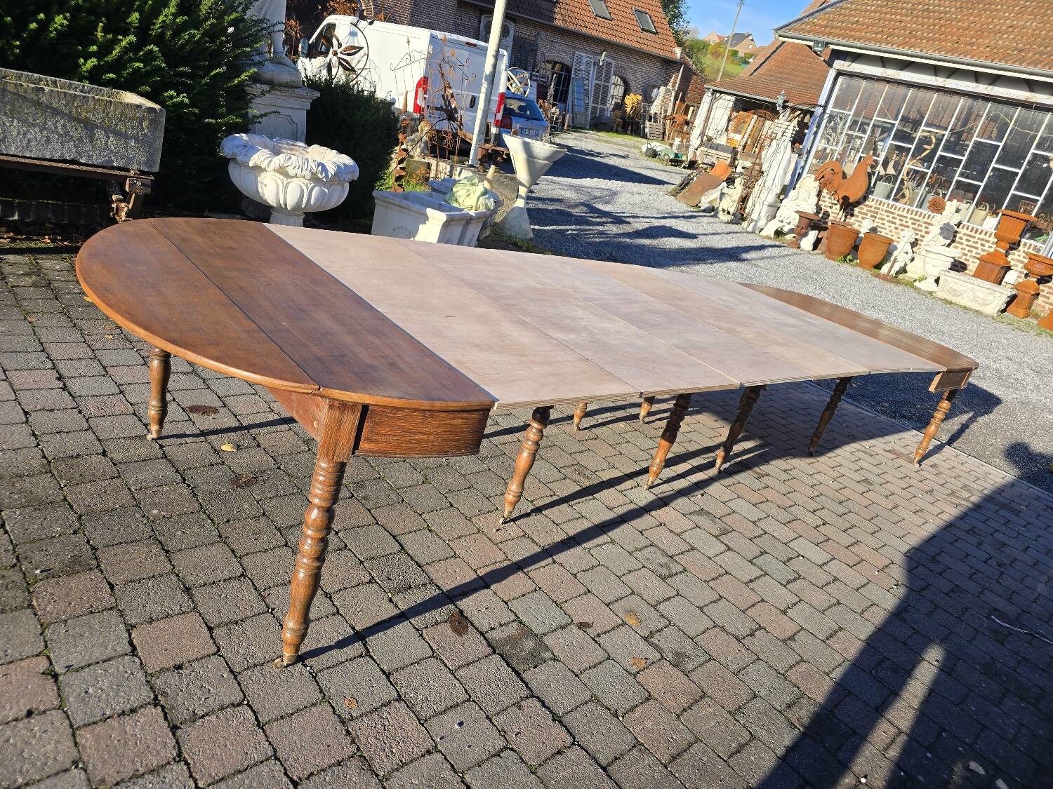 12-foot round oak table with 7 extensions / 20 people