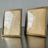 Pair of gold colored  metal art deco picture frames