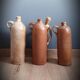 Trio of sandstone carafes with cove