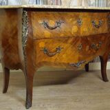 Curved Louis XV style commode with floral marquetry and marble top.