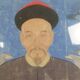 A framed Chinese ancestral portrait is a traditional hand-painted