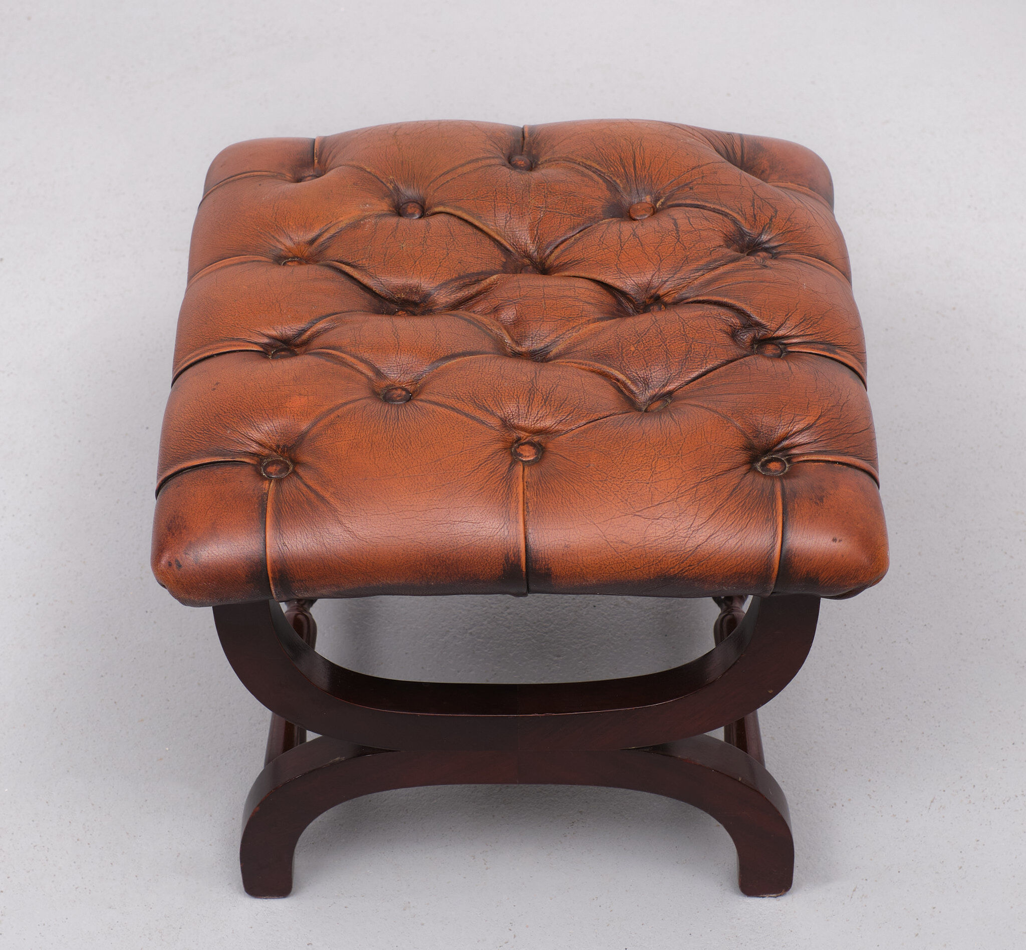 English country house style padded leather ottoman