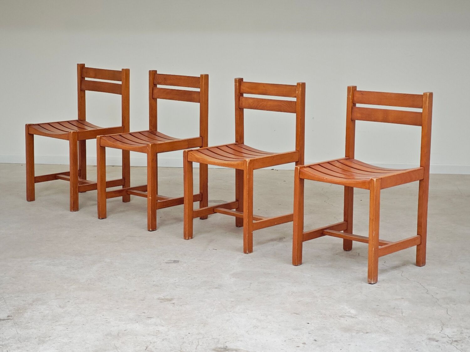 Set of 4 wooden chairs by André Sornay