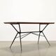 1960s vintage table made of wood and metal with a glass top, Italy.