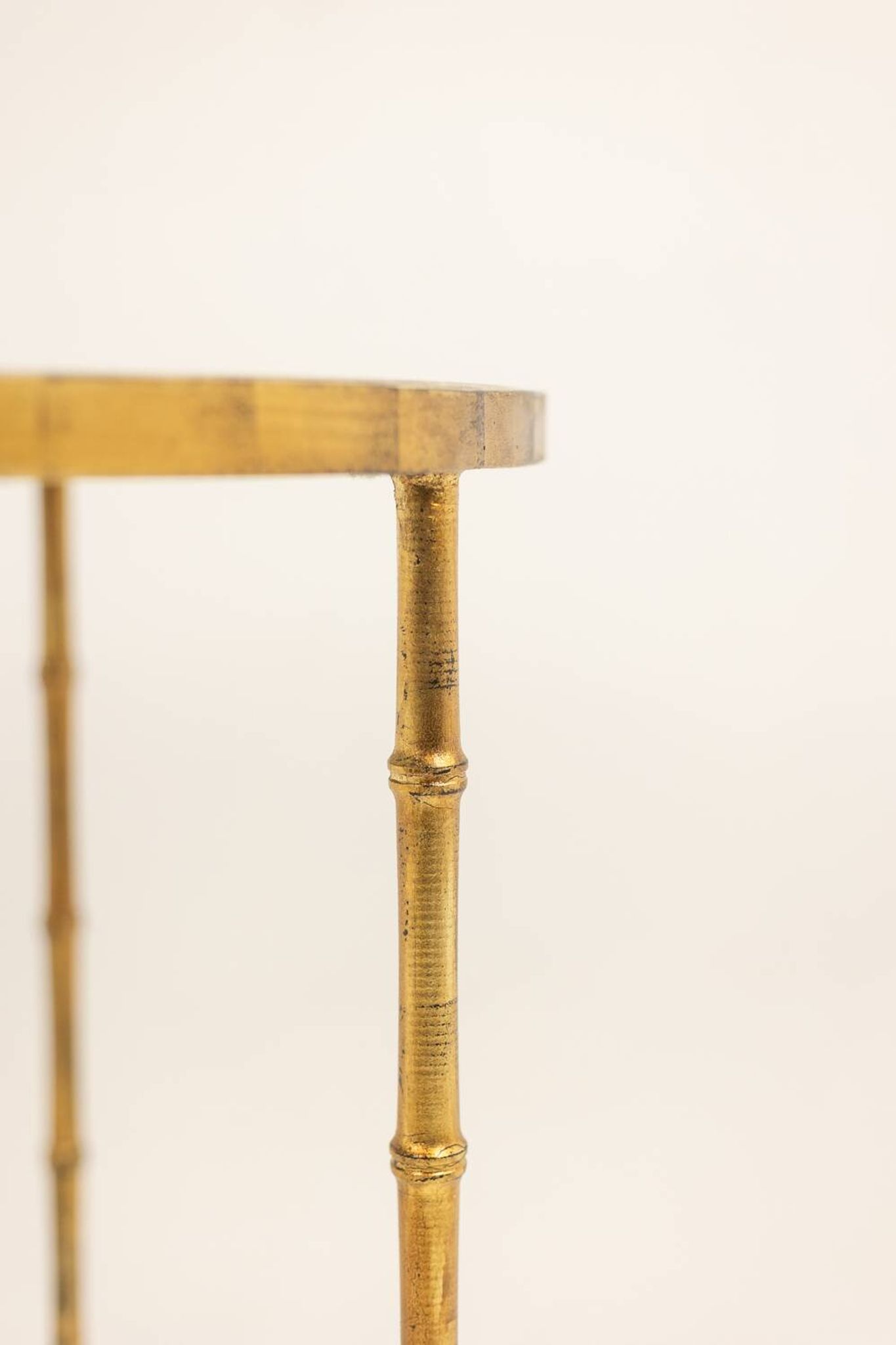Golden metal side table with a grey marble top, 20th century.