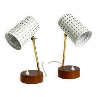 A pair of mid-century modern bedside lamps with perforated metal shades