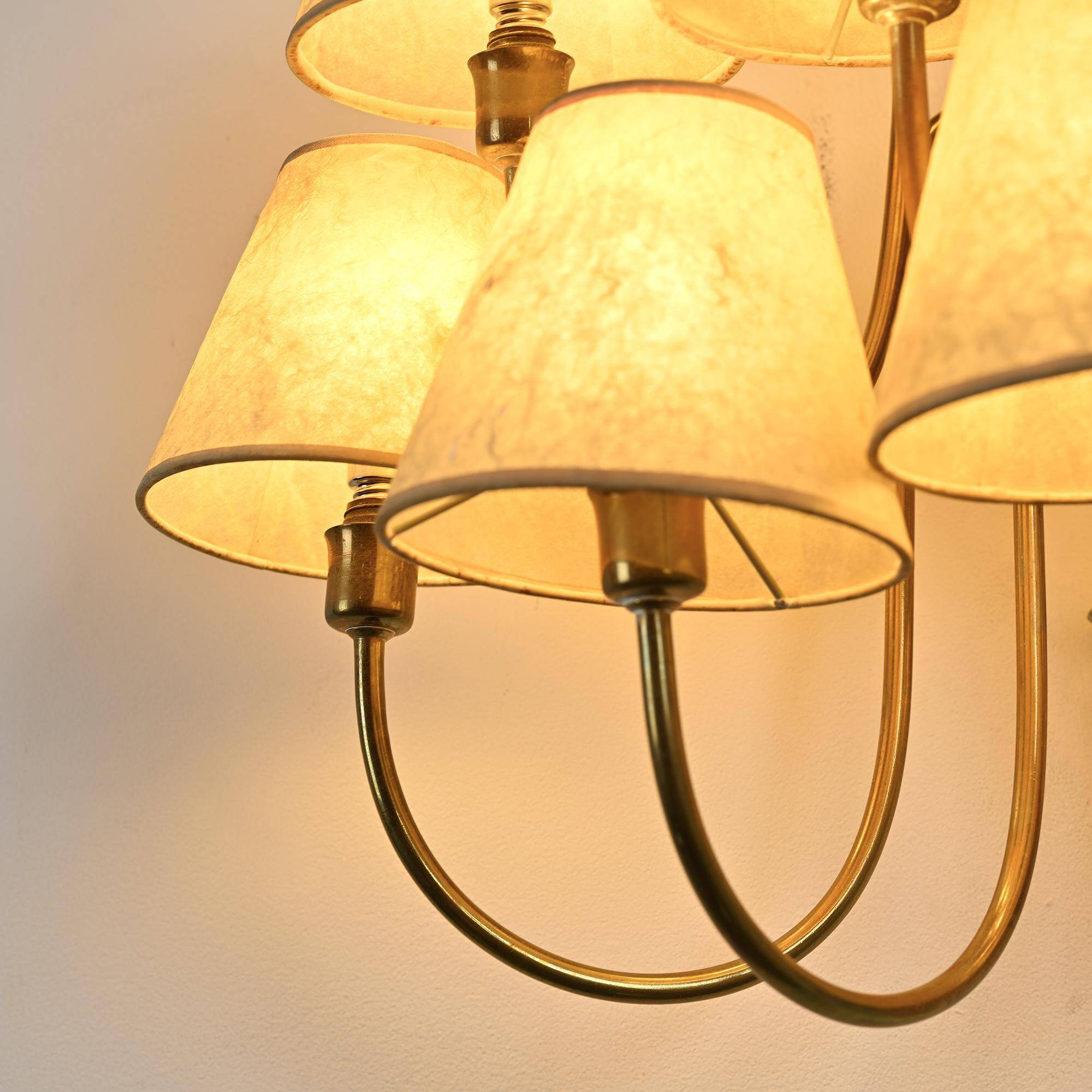 Wall sconce with nine arms in brass, France, circa 1950.