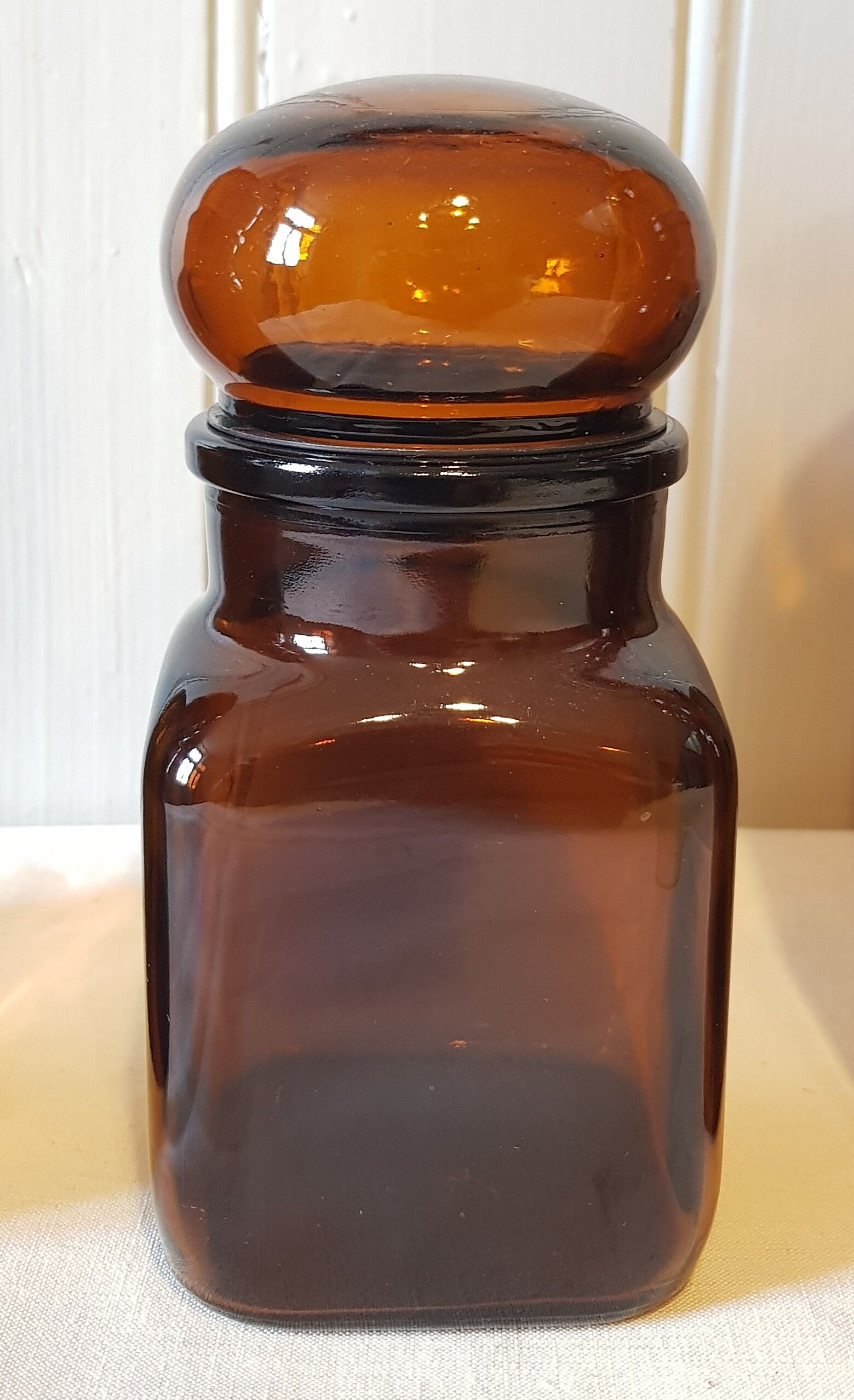 Series of 4  amber glass jars 70
